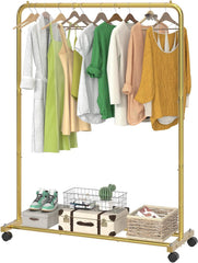 Gold clothing rack with clothes and shoes on a white background