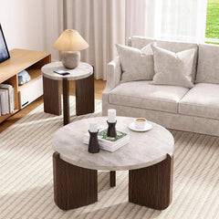 Living room with a round coffee table, side table, and sofa.