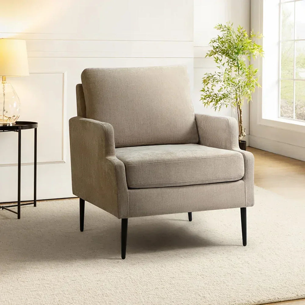 beige accent chair in a living room.