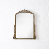 Decorative gold mirror on a white background