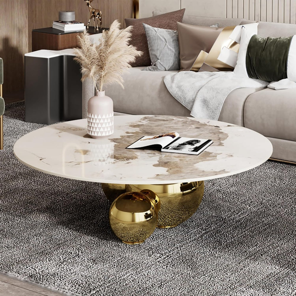 Modern living room with a marble coffee table and decorative pillows.