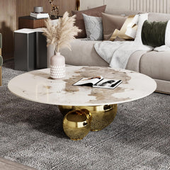 Modern living room with a marble coffee table and decorative pillows.