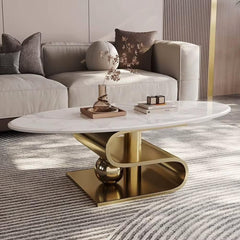 Modern living room with a white marble coffee table and gold base, featuring a sofa with decorative pillows.