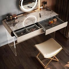 Modern vanity table with marble top and illuminated mirror, accompanied by a stool.