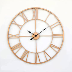Large round wall clock with rose gold frame and Roman numeral markers on a white background