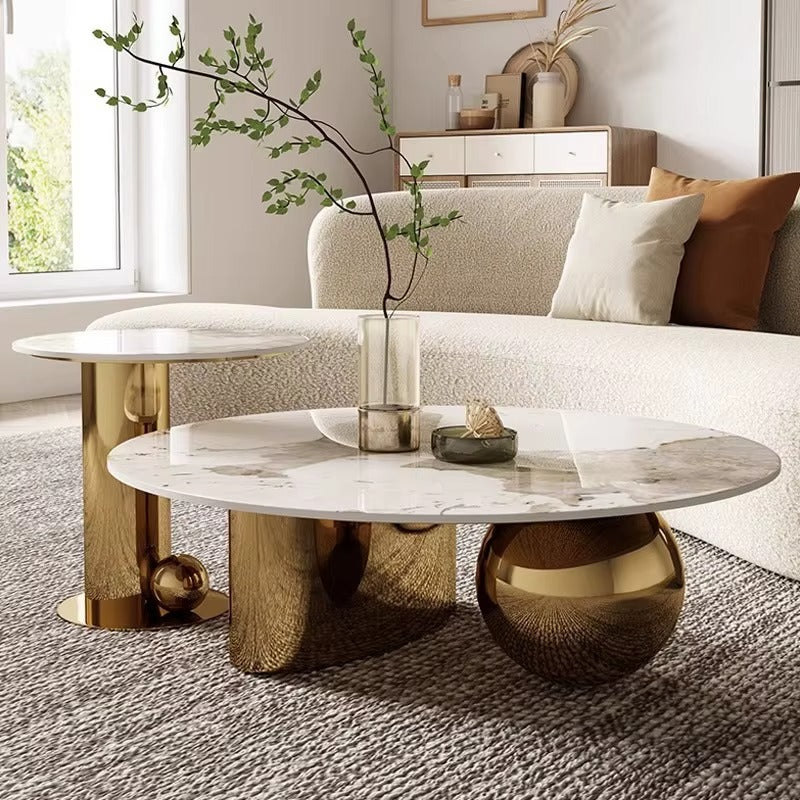 Modern living room with a marble coffee table and decorative elements.