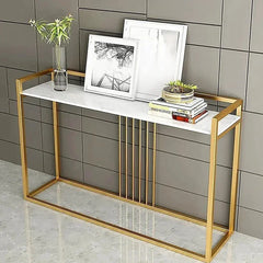 Console table with marble top and gold frame against a tiled wall.