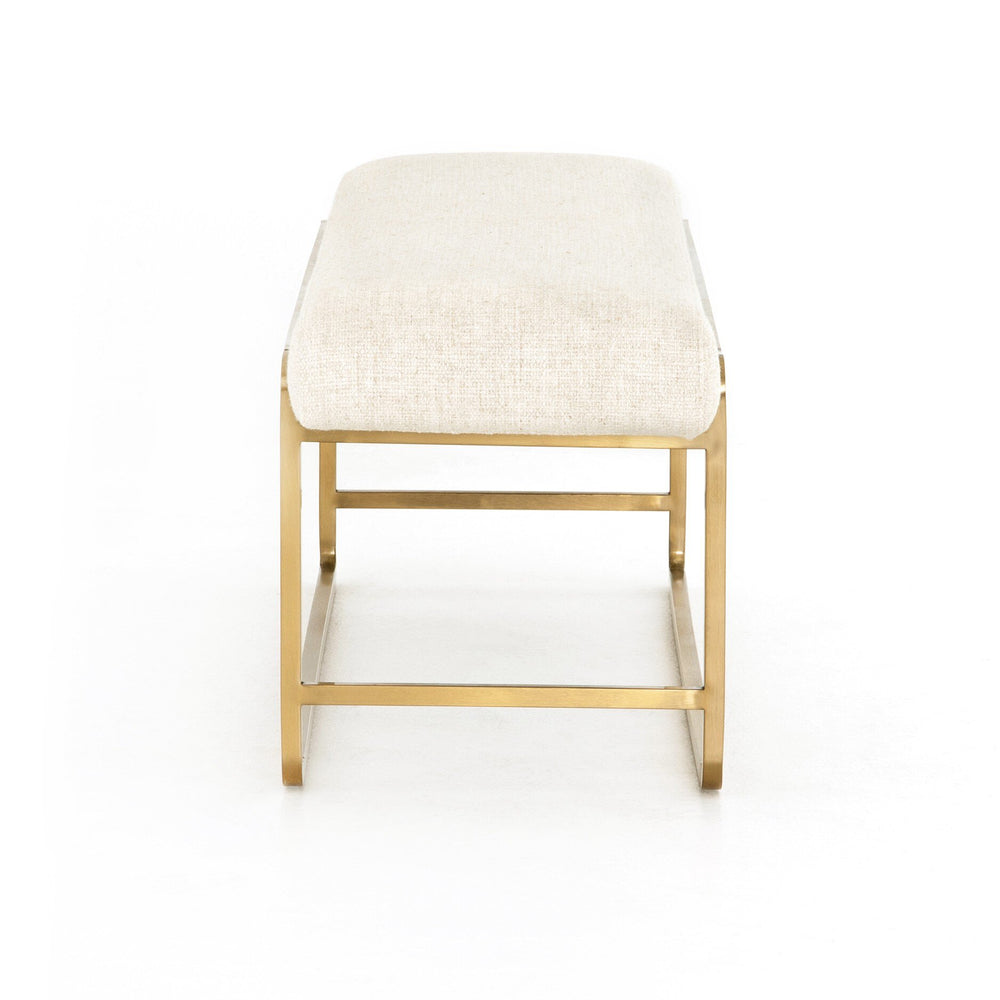 Stool with white cushioned seat and gold metal frame on a white background