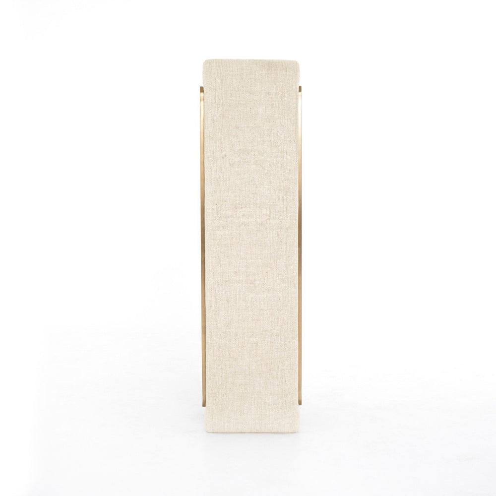 Tall, narrow cabinet with a textured white finish and gold accents on a white background