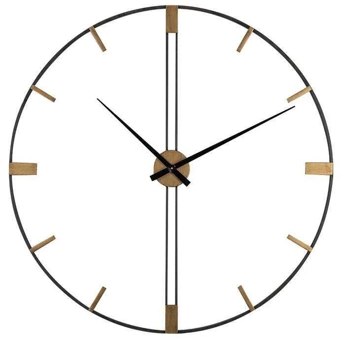 Round wall clock with black frame and gold accents on a white background