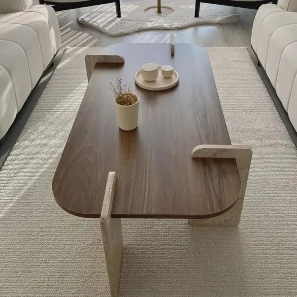 Wooden coffee table with decorative items in a living room setting