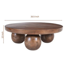Wooden table with spherical bases and dimensions on a white background