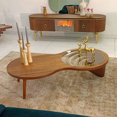 Wooden coffee table with decorative items in a living room setting