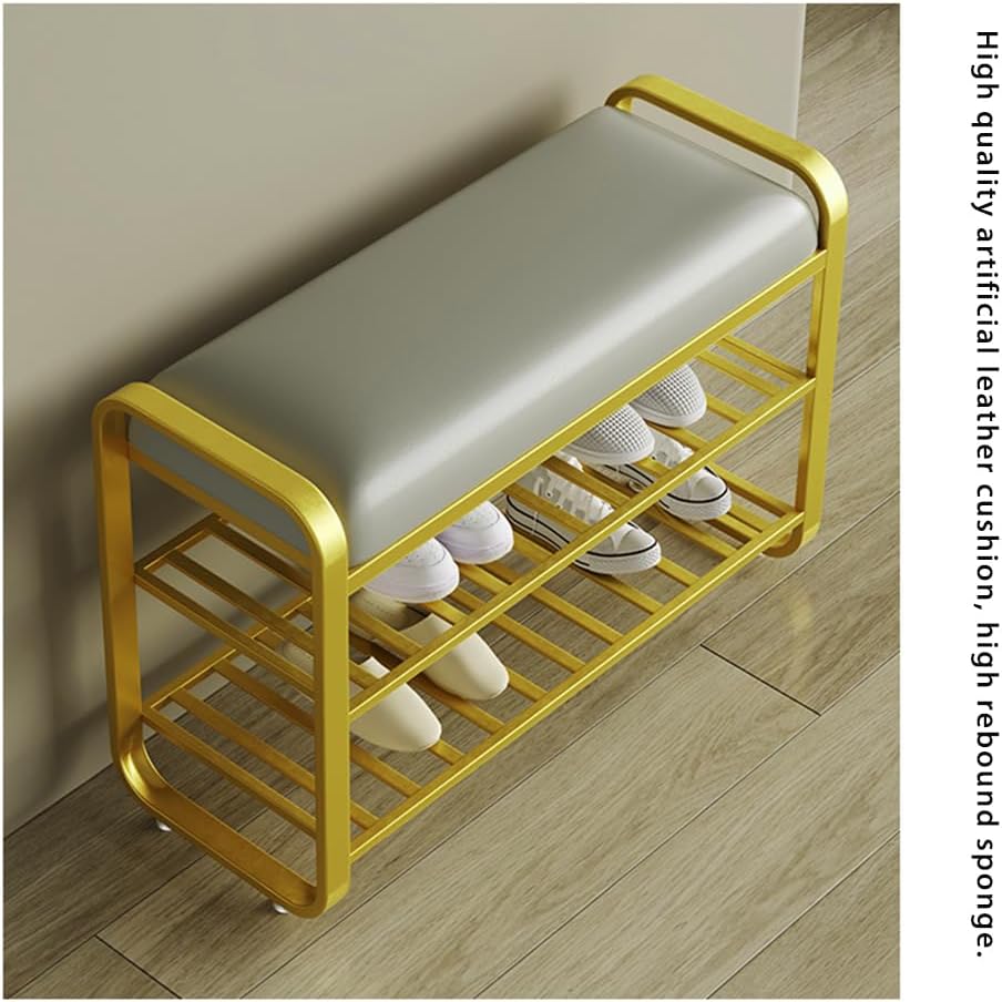 Shoe rack with a cushioned seat on a wooden floor, holding white shoes.