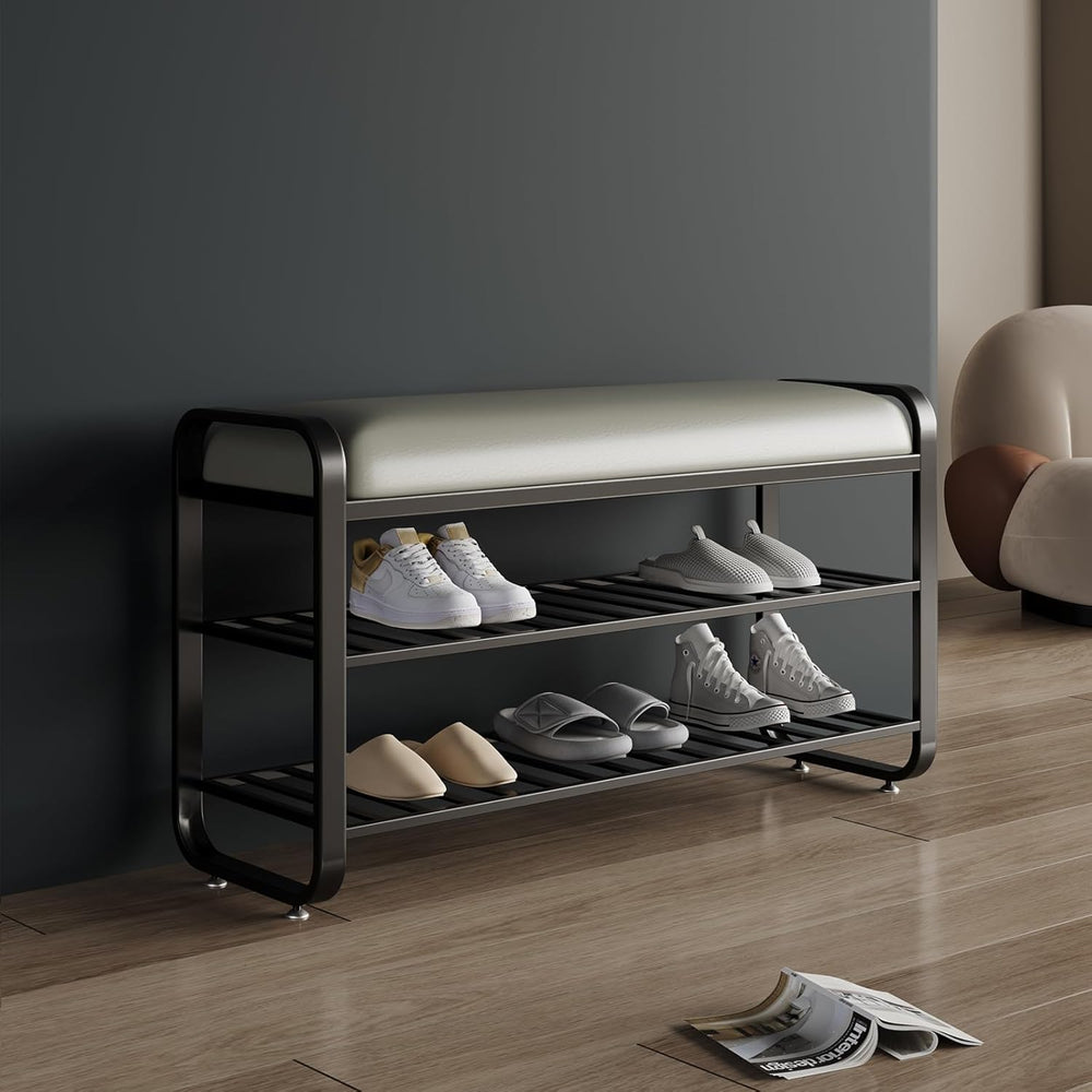 Shoe rack with shoes on a wooden floor against a gray wall