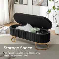 Black storage bench with open lid in a room setting, featuring text about its storage capacity.