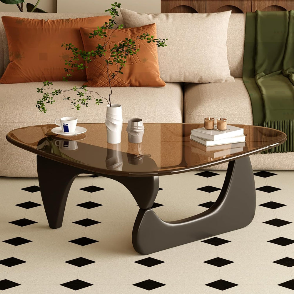 Modern coffee table with decorative items in a living room setting