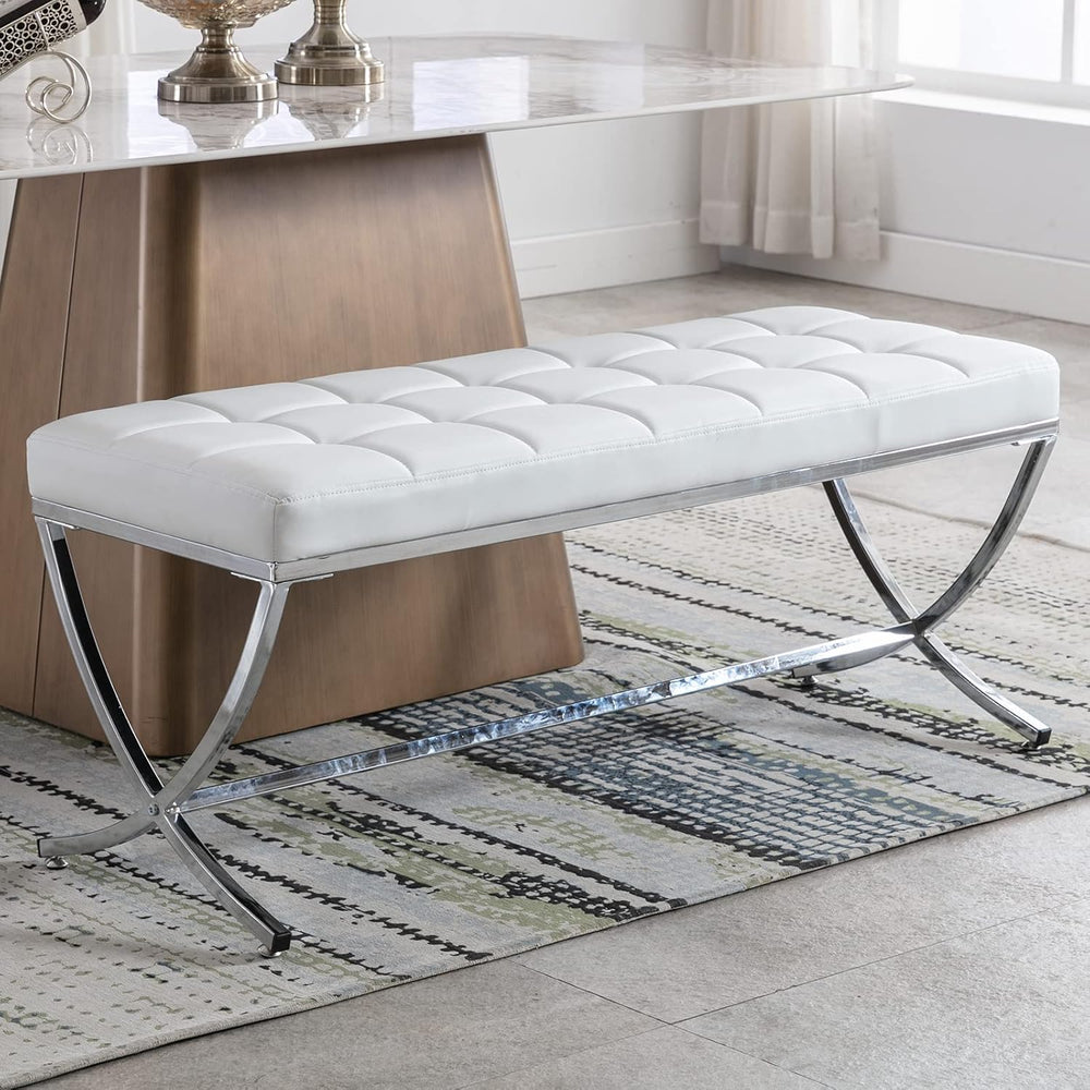 White tufted bench with metal legs in a room setting