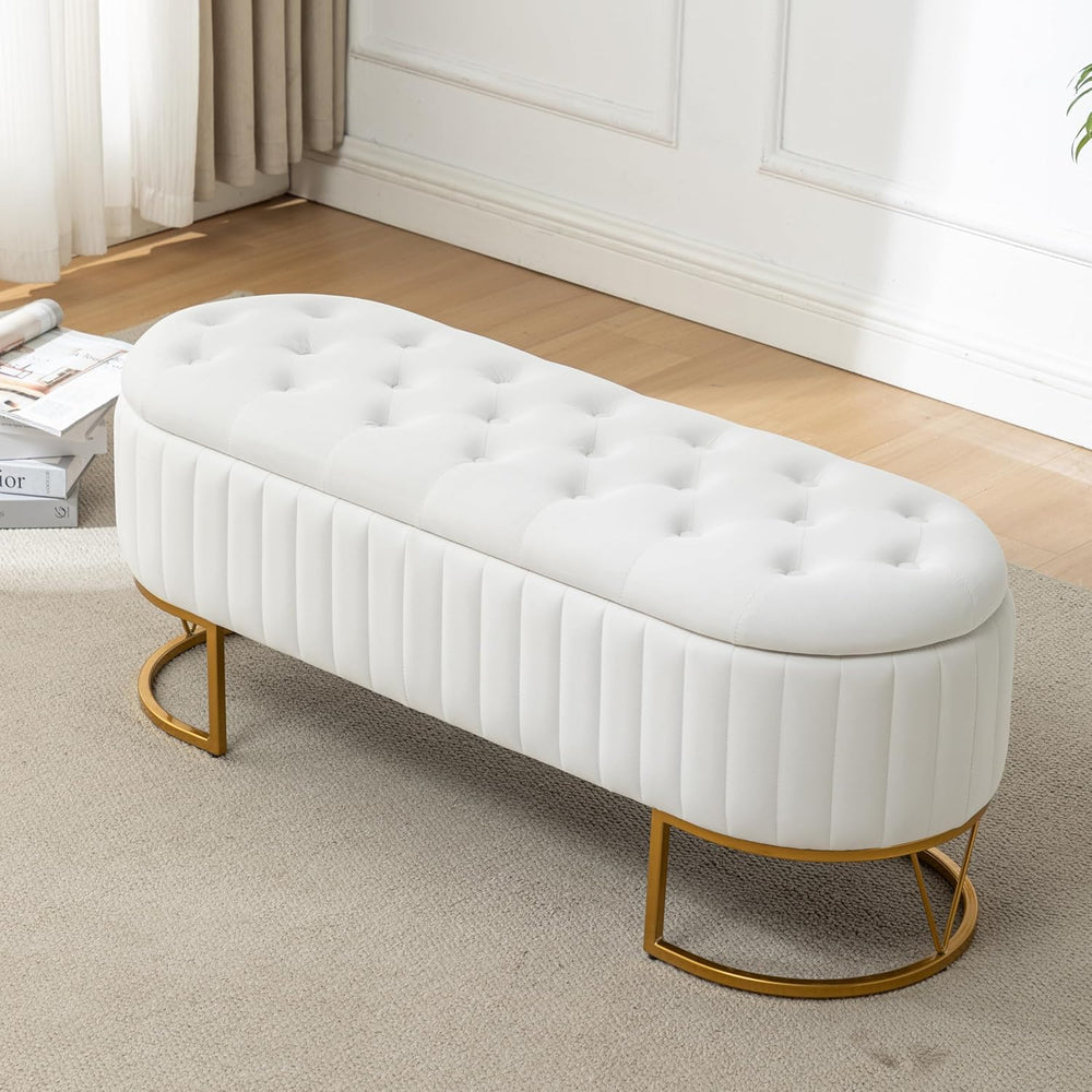 White tufted bench with gold legs in a room setting