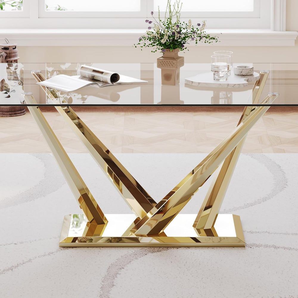 Glass table with gold metal base in a room setting
