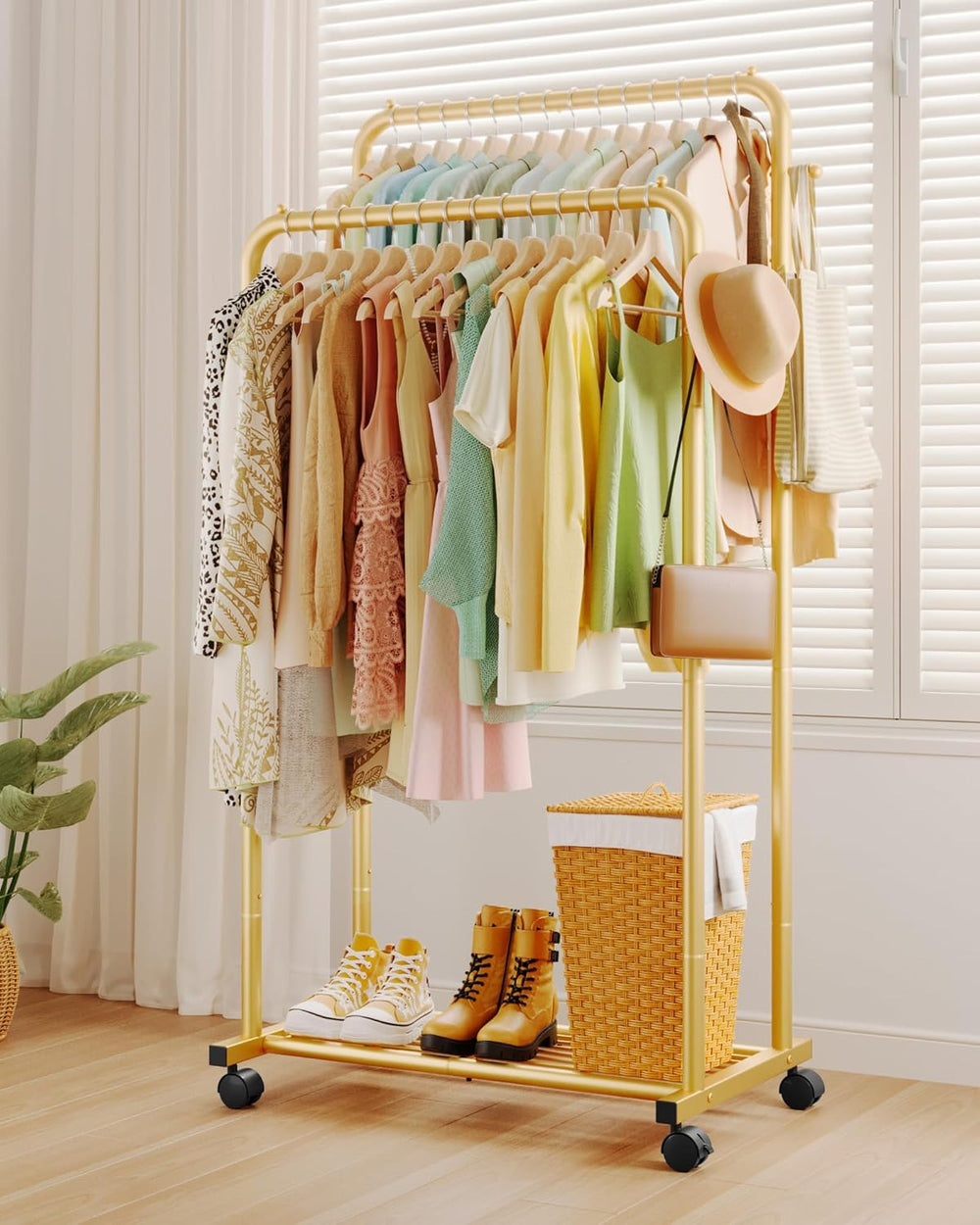 Yellow clothing rack with clothes, shoes, and a basket in a room.