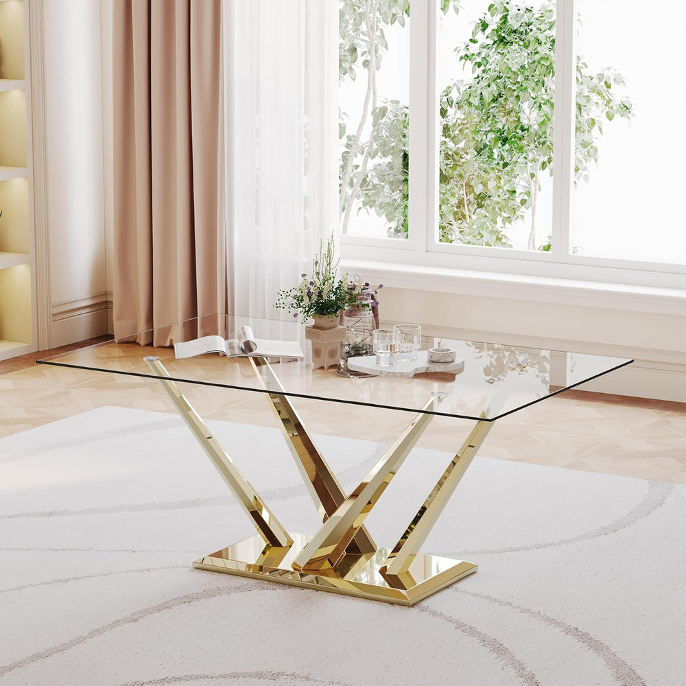 Glass coffee table with gold legs in a modern living room
