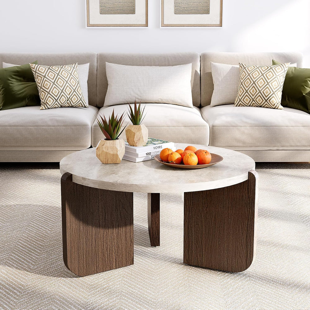 Modern living room with a beige sofa, marble coffee table, and decorative elements.