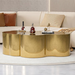 Gold coffee table with decorative items in a living room setting