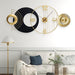 Modern wall clock with geometric design in a living room setting