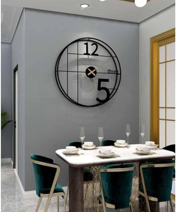 Dining room with a modern wall clock on a gray wall