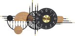 Decorative wall clock with black and gold design on a white background