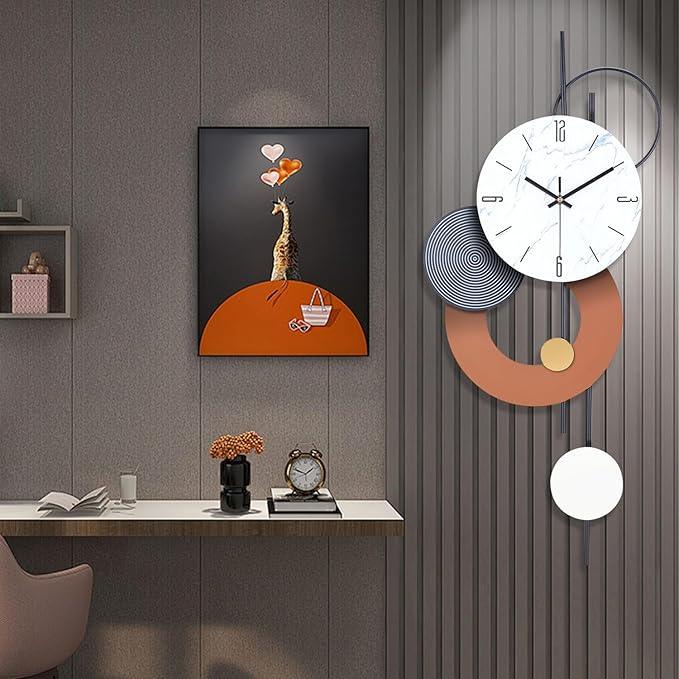 Decorative wall clock with abstract design on a gray wall above a desk.