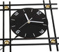 Black clock with white hands on a decorative metal grid background