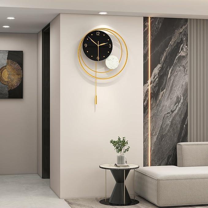 Modern wall clock in a stylish living room setting with a sofa and decorative elements.