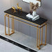 Console table with gold frame and black marble top in a room setting