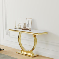 Gold console table with marble top against a white wall