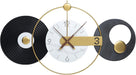 Modern wall clock with gold and black design on a white background
