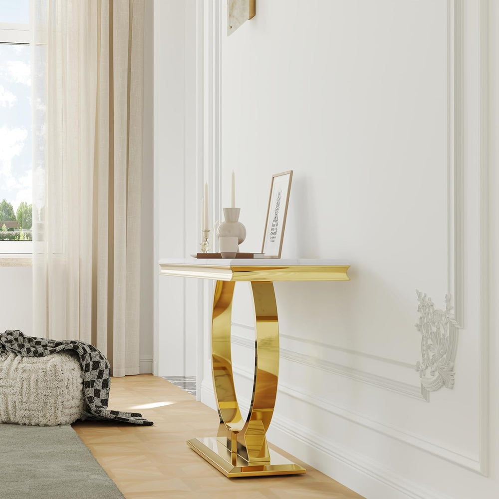 Gold side table in a room with a window and decorative elements.