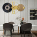 Modern dining room with a stylish wall clock, table, and chairs.