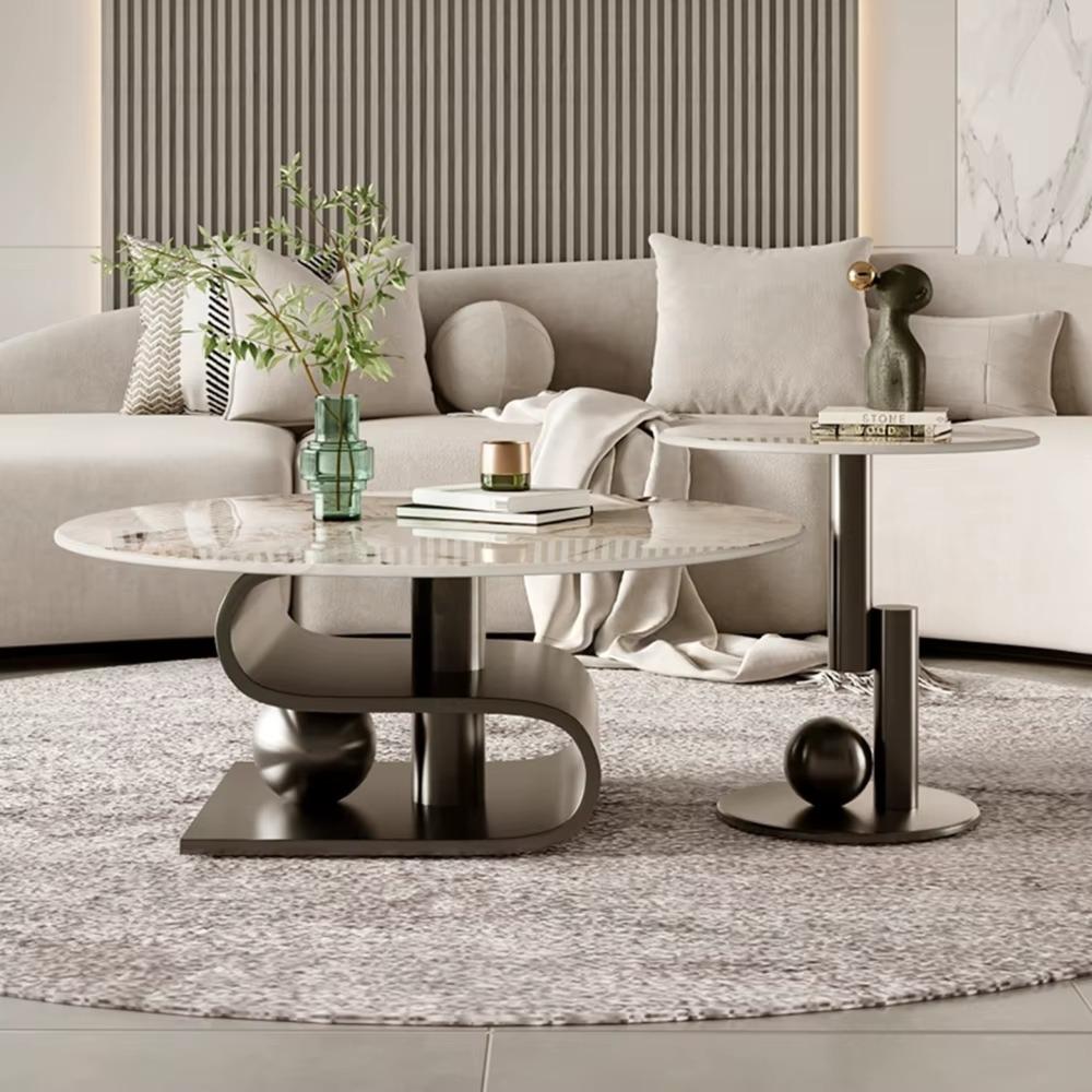 Modern living room with a gray sofa, marble coffee table, and decorative items.