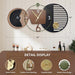 Decorative wall clock with detailed design elements on a wooden surface.