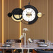 Modern wall clock with decorative design in a dining room setting