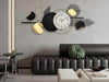 Modern wall clock with geometric design in a living room setting