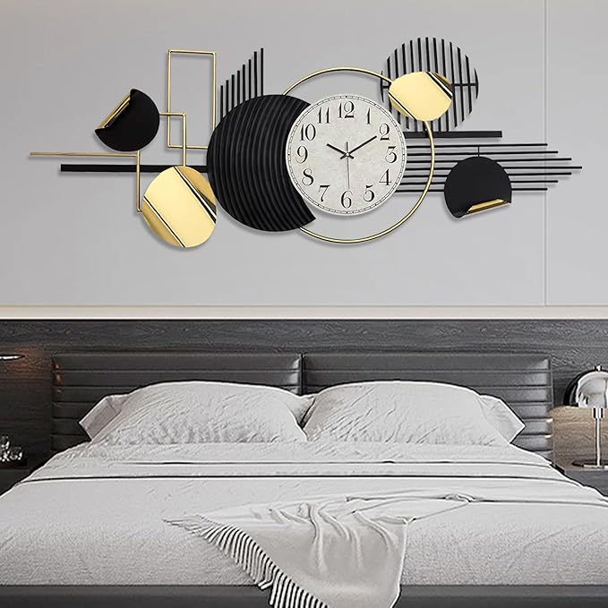 Decorative wall clock with geometric design above a bed in a bedroom setting