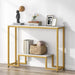 Console table with gold frame and white top, displaying books and decor items.