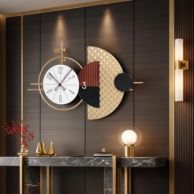 Decorative wall clock with abstract design on a dark wall with lighting fixtures.
