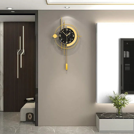 Modern wall clock with gold accents on a gray wall in a stylish interior setting.
