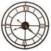 Large round wall clock with Roman numeral markers on a white background