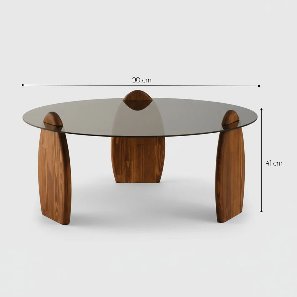 Coffee table with wooden legs and glass top, shown with dimensions on a white background