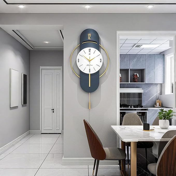 Modern wall clock on a gray wall in a home interior setting with a dining area.